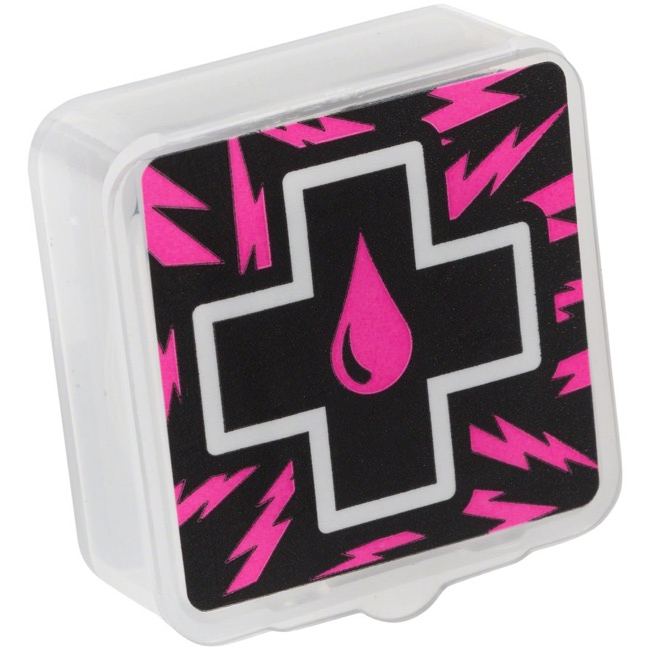 A small plastic container with a black cross and pink droplet design, surrounded by pink lightning bolts on a black background, ideal for storing your Muc-Off - Glueless Patch Kit for bicycle inner tubes.