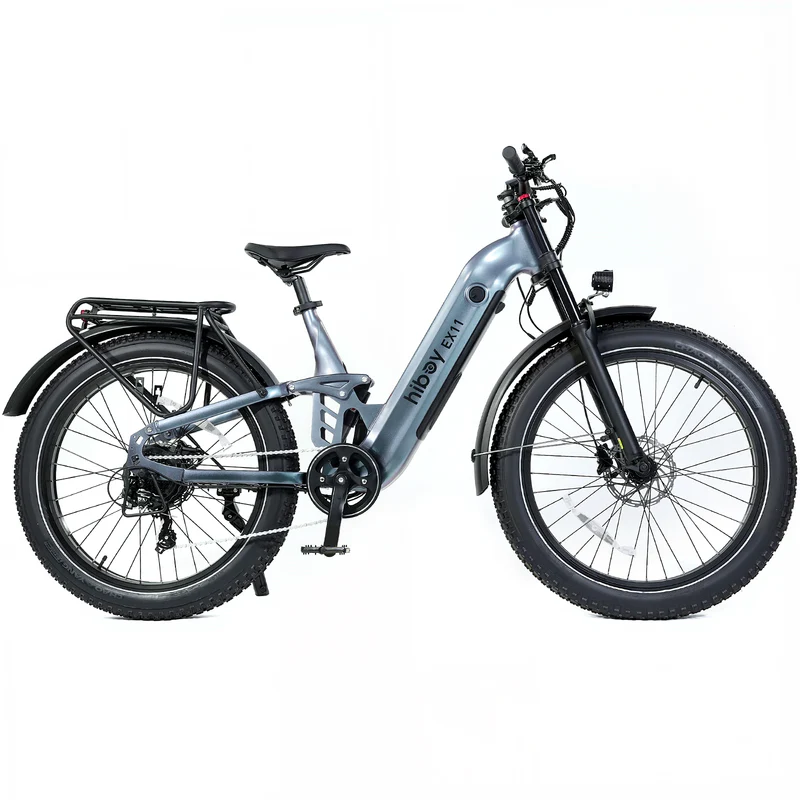 The Hiboy EX11 by Hiboy is a silver commuter e-bike with fat tires, a 750W motor, front suspension fork, rear rack, and integrated frame battery, shown from the side on a white background.