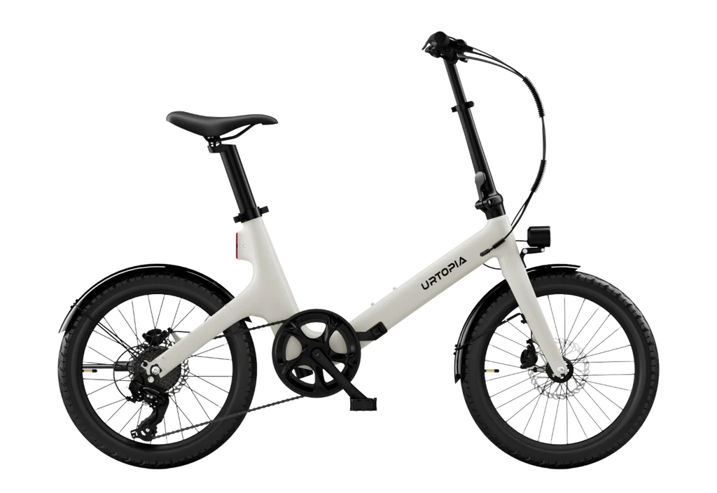 The Urtopia Carbon Fold Step-Thru by Urtopia is a white folding electric cruiser bike with black wheels, pedals, handlebars, and seat, shown in side profile against a plain background and featuring a long-range battery for extended rides.