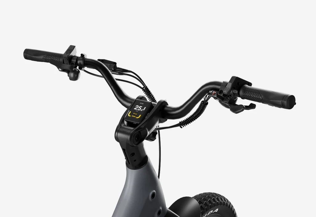 Close-up view of the handlebars and digital display of the Urtopia - Carbon Joy Ultra by Urtopia, showing speed as 25.1 km/h on this long-range electric bike.