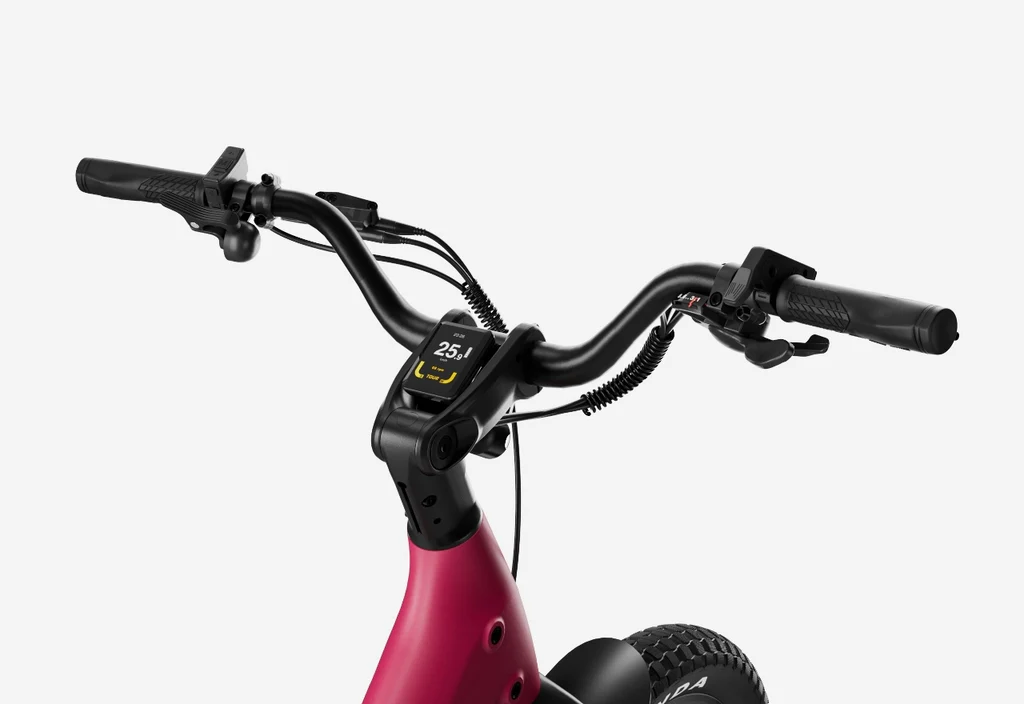 Close-up of Urtopia - Carbon Joy Ultra electric bike’s red handlebars, featuring a digital display with speed and battery info, set against a white background.