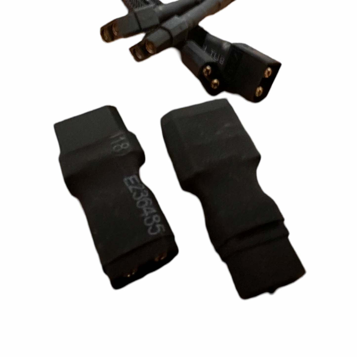Two black ElectricAllWheel Premium (12AWG) XT60 Extension Cables with XT60-XT90 adapters are shown close up on a white background, with three more connectors visible in the background.