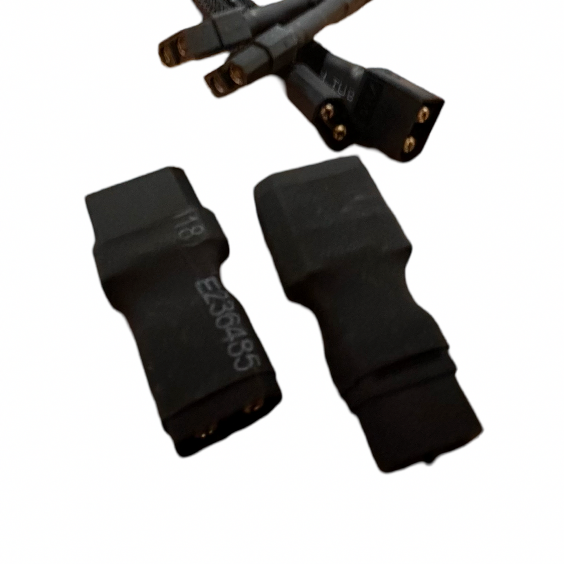 Two black ElectricAllWheel Premium (12AWG) XT60 Extension Cables with XT60-XT90 adapters are shown close up on a white background, with three more connectors visible in the background.