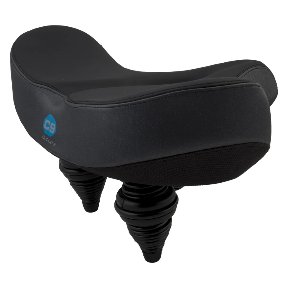 The CLOUD-9 Flex-Curve XL Airflow bike seat by CLOUD-9 is wide and black, features dual suspension springs, airflow technology for cooling, and displays the C9 Cloud 9 logo on the side.