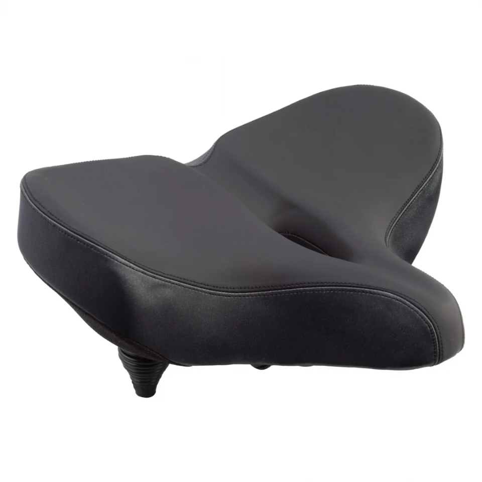 The CLOUD-9 Flex-Curve XL Airflow, a wide black comfort bike seat from CLOUD-9, features a split design, thick ergonomic padding, and is shown angled against a white background.