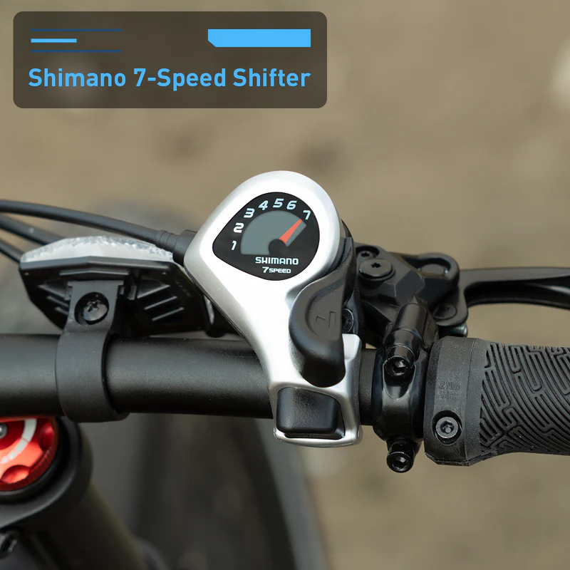 Close-up of the Shimano 7-speed shifter on the Hiboy EX11 commuter e-bike handlebar, displaying gear numbers 1 to 7.