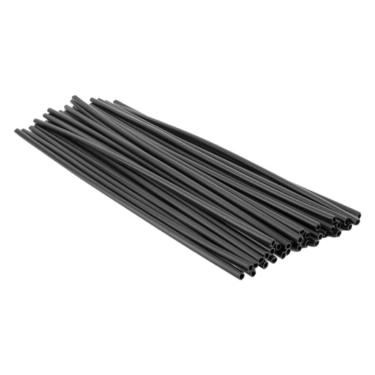 A bundle of Black Ops Spoke Covers by Black Ops, resembling 300mm black heat shrink tubing, neatly arranged in a pile against a white background.