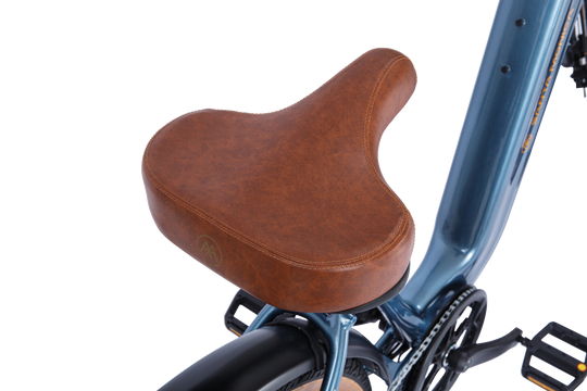 A close-up view of an AIMA - Santa Monica with a brown leather saddle attached to a blue frame, perfect for urban commuting with its powerful 750W motor.