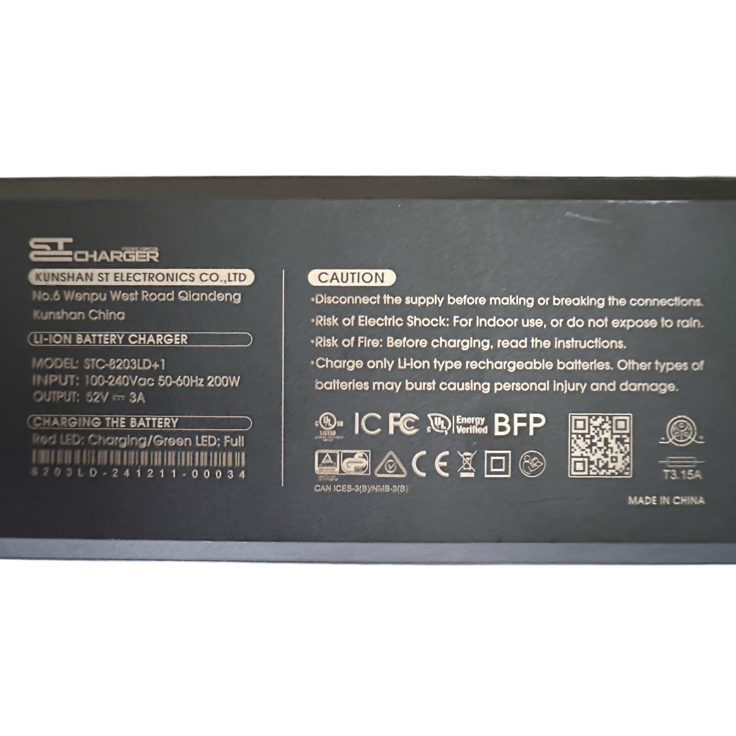 Label on the ElectricAllWheel 52V E-Bike Battery Charger ST3 3A (Ariel Rider Fit) showing manufacturer, model, input/output specs, caution notes, and certification icons for Ariel Rider electric bike batteries.