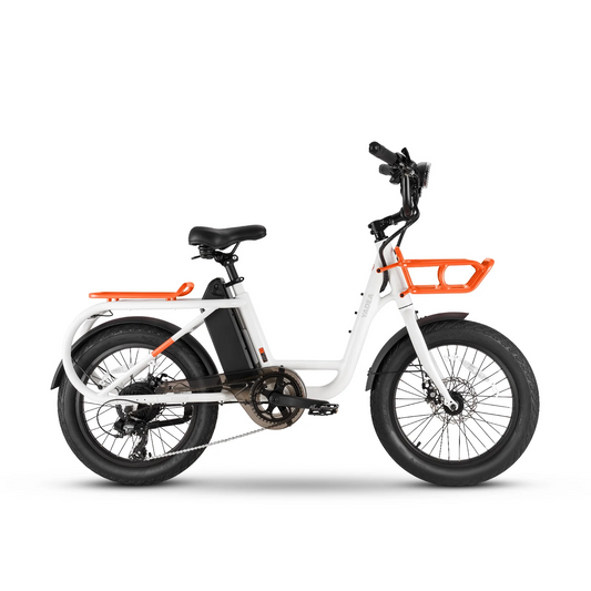 A white Yadea - Cocoa from Yadea with thick tires, an orange front basket, and black seat. The bike appears grounded with no background or surroundings.