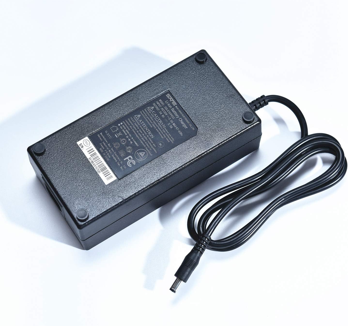 An ac adapter for an electric scooter on a white background - Charger - Sans 54V 2A.