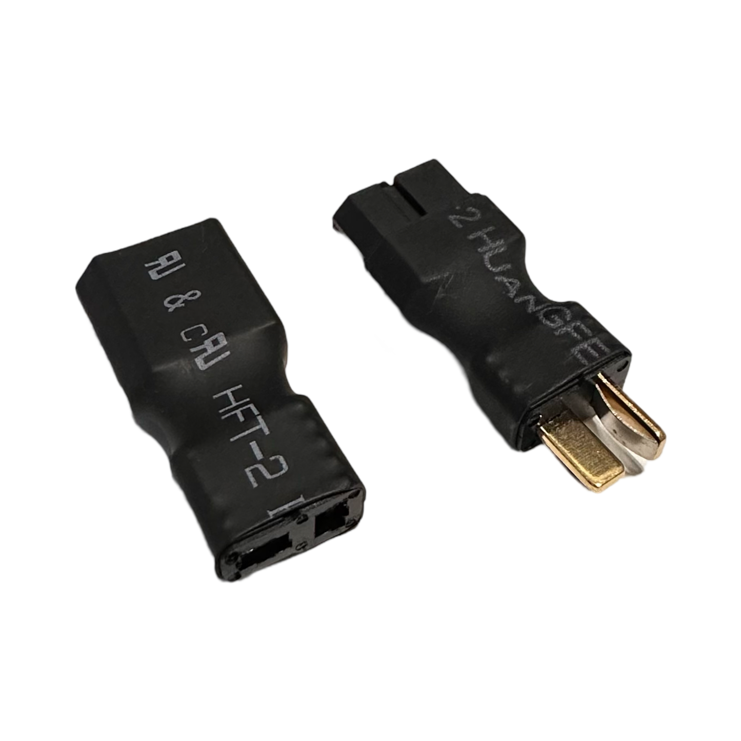 Two black plastic connectors from the ElectricAllWheel DateX2 Dx2 30A Universal Dual Battery Dual Output Discharge Balancer Kit are shown—one with metal prongs, one with slots—on a white background.