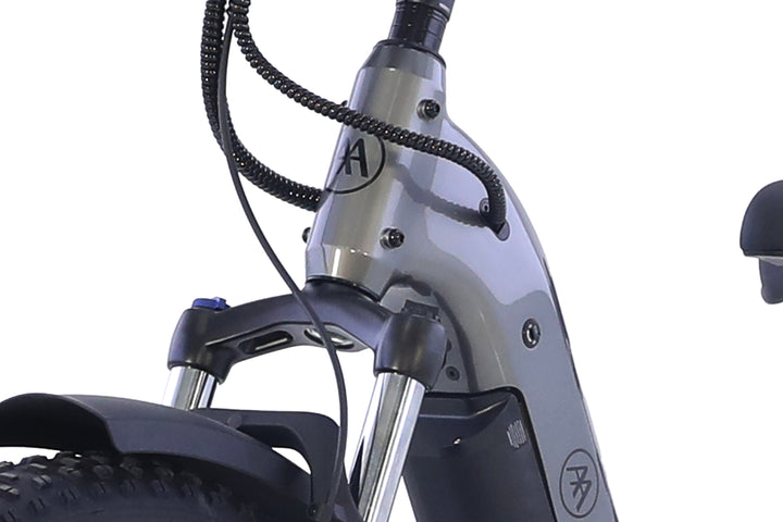 Close-up of the AIMA - Big Sur 2.0 electric scooter's front frame and fork in gray, highlighting wiring and part of the front tire against a white background.