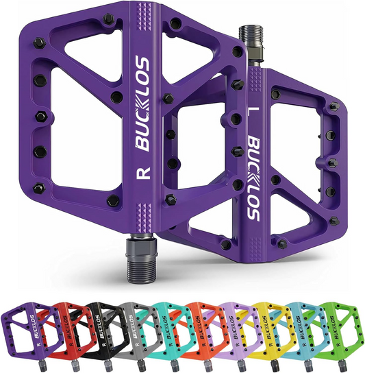 Image of Tampa Bay eBikes' Bucklos bike pedals available in various colors, showcasing left and right cycling pedals in purple. These pedals feature a wide, flat platform with multiple pins for a strong grip and an ergonomic design that ensures comfort on every ride. Additional color options include black, red, orange, green, blue, and yellow.