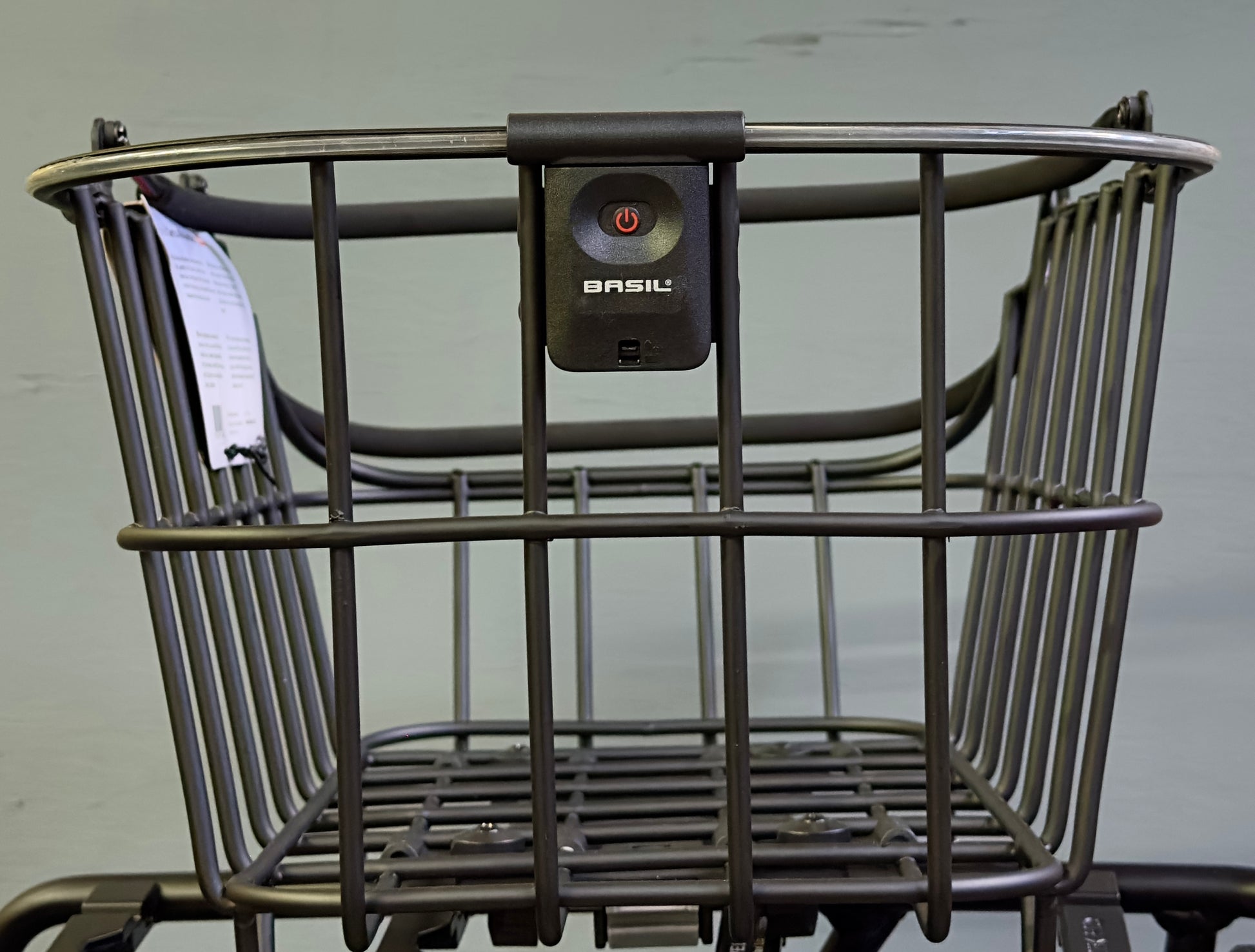 A rear bicycle basket, the Basil Cento MIK by Basil, crafted from weatherproof aluminum with a black finish, is shown against a plain light background.