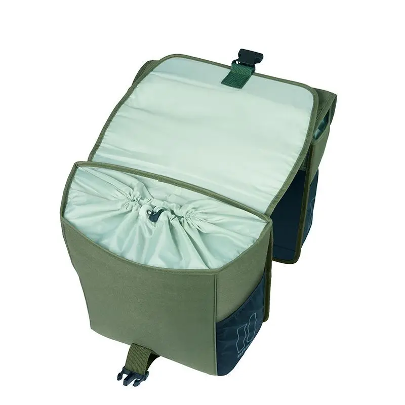 The Basil Go MIK Double Pannier Bag by Basil is shown in green and gray with its top flap open, revealing a drawstring closure on the main compartment.