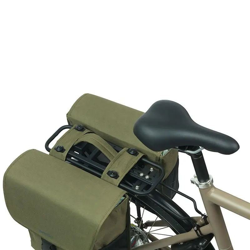 A bicycle with two Basil Go MIK Double Pannier Bags by Basil, in olive green, attached to the rear rack and viewed from above near the black saddle.
