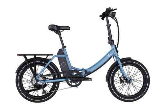 The Blix Vika X by Blix is a blue commuter eBike with a step-through frame, rear cargo rack, and lower tube-mounted battery, shown from the side against a white background.