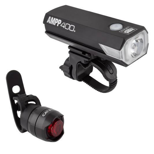 A front bicycle light labeled "Light Combo - Cateye AMPP 400 Headlight and Taillight" with a rechargeable 400 lumen headlight and a small black rear bicycle light featuring an OptiCube lens technology red lens are displayed against a white background, perfect for intermediate level riders.