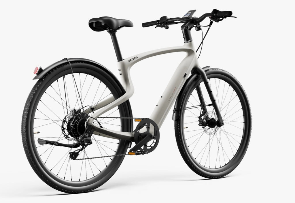 The Urtopia - Carbon Classic by Urtopia features a matte gray curved frame, rear hub motor, fenders, disc brakes, and a handlebar display. Showcased on a white background, this lightweight eBike offers modern style and advanced technology.
