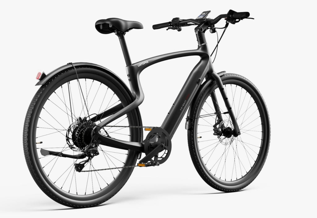 A Urtopia - Carbon Classic eBike by Urtopia in matte black with thick tires, straight handlebars, rear fender, disc brakes, and a handlebar-mounted display is shown against a plain white background.