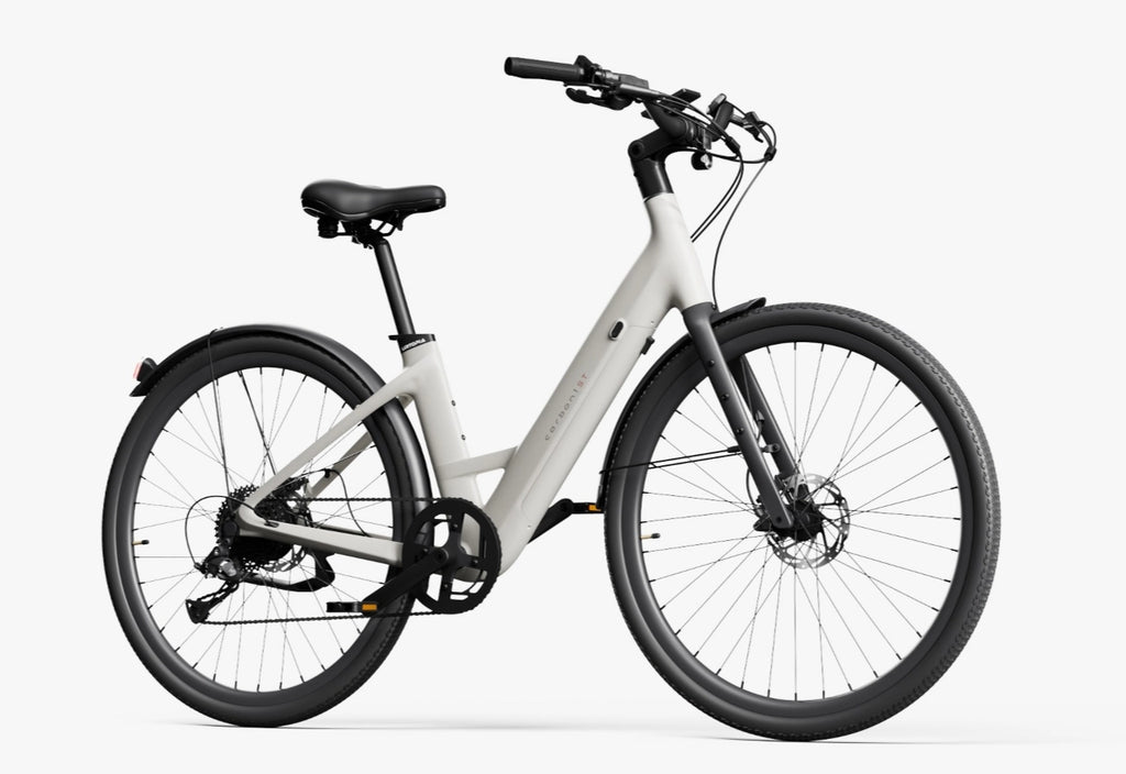The Urtopia Carbon Classic Step-Thru, a modern white carbon eBike by Urtopia with black handlebars, removable Samsung battery, and wide tires, is displayed on a plain white background.