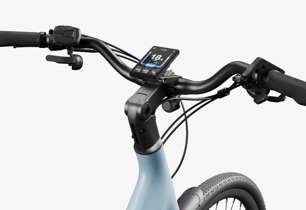 Close-up of the Urtopia Carbon Classic Step-Thru eBike’s lightweight carbon handlebar, featuring a digital display with speed and metrics, brake levers, and its light blue frame from Urtopia.