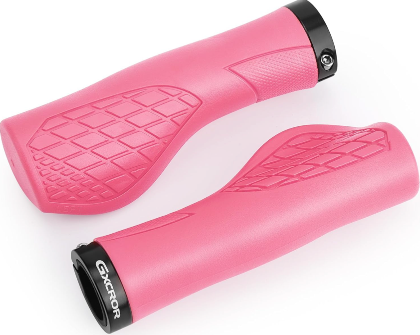 Two pink "Grips - Color Splash" by Tampa Bay eBikes, ergonomic with textured anti-slip surfaces and black locking rings on one end, labeled "GXCROR.
