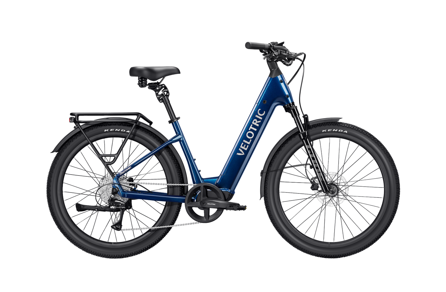 The Velotric Discover 3 comfort eBike by Velotric is shown in blue with black tires, a rear cargo rack, front suspension fork, and upright handlebars in side profile against a white background.