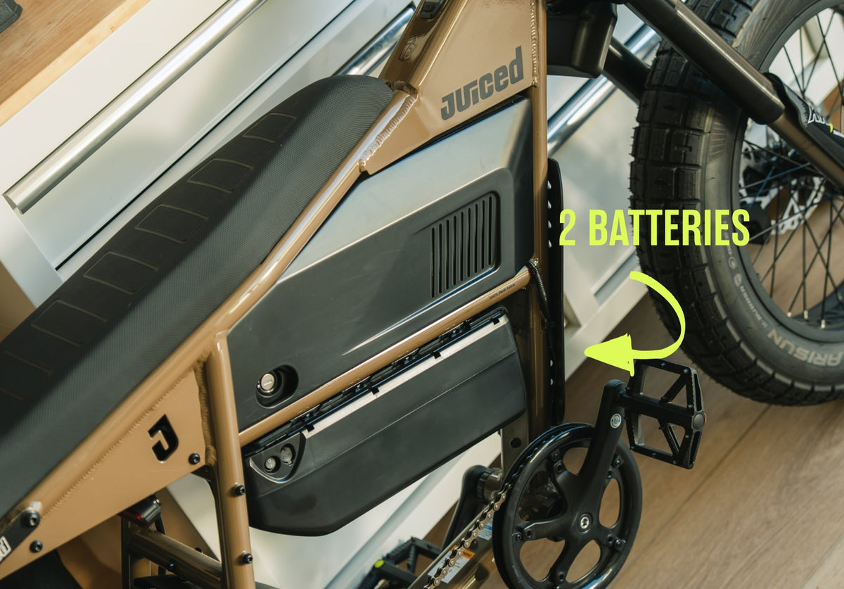 Juiced Scrambler Dual-Battery Hardtail — Mocha frame closeup showing both batteries