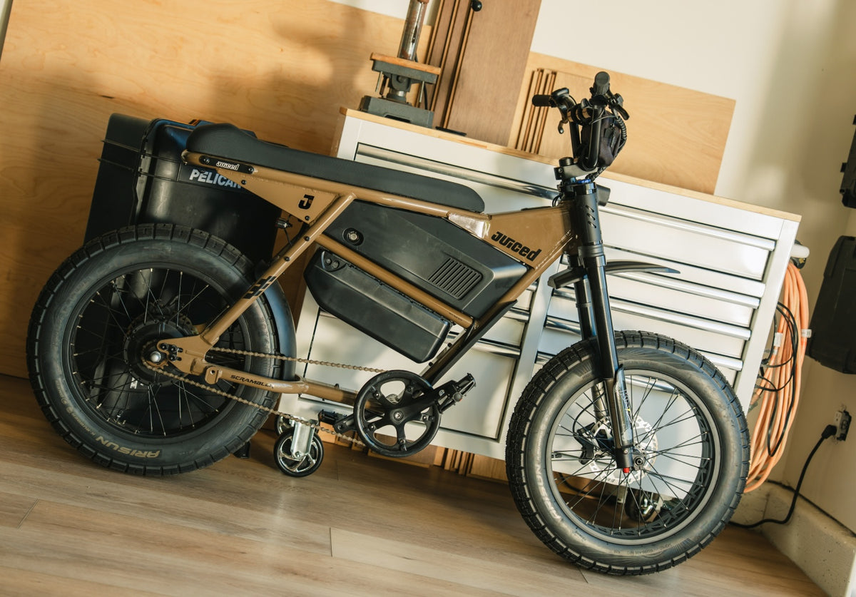 Juiced Scrambler Dual-Battery Hardtail — Mocha dual-battery bike in a workshop
