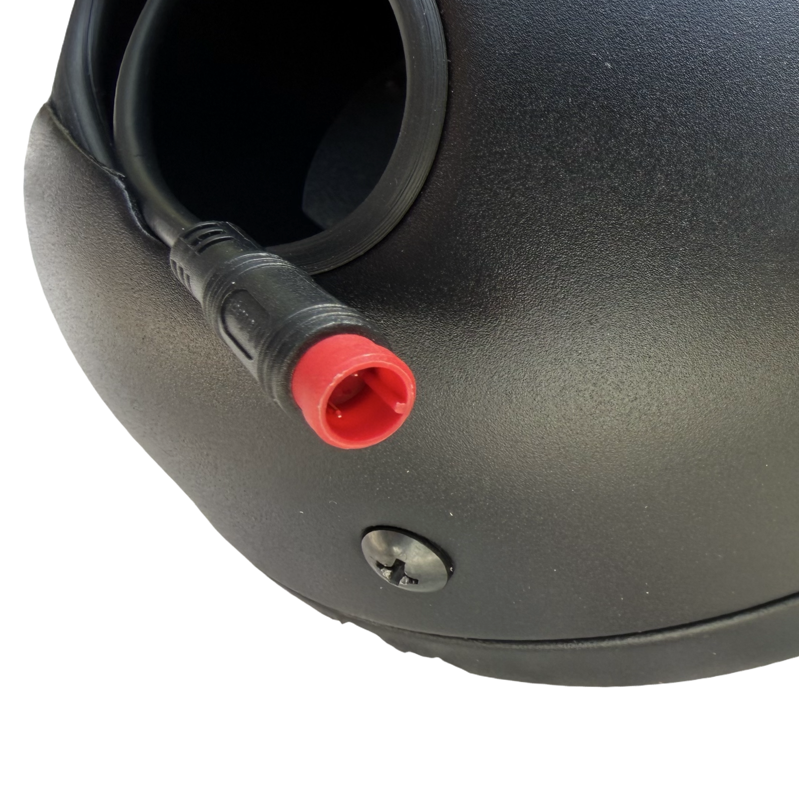 Close-up of the ElectricAllWheel RST Guide Dual Crown Fork (26" Fat Tire) & Motorcycle Style LED Headlight Kit (12V, 2-pin Julet) showing a black device with a red-tipped connector and screw, ideal for e-bike upgrades.