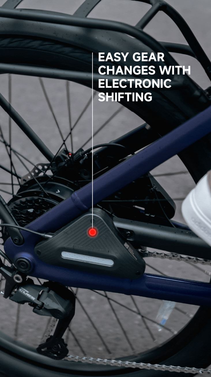 Close-up of the Segway Myon's rear wheel and gear system with text: "Effortless electronic gear shifting—perfect for commuters, offering an impressive 80-mile range.