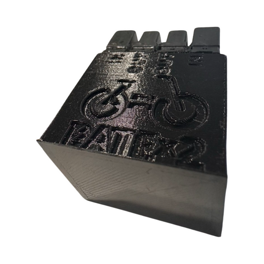 A black 3D-printed object by ElectricAllWheel, labeled "BAT" with a bicycle symbol, designed for DateX2 Dx4 (30A continuous, 60A max) 4x Input Dual 4x Output Battery Balancer users; features three tabs at the top.
