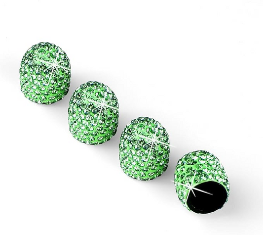 Four EPWR Valve Gems - Jade valve stem caps, embellished with green rhinestones, are arranged on a white surface, with one cap tilted to reveal its open end.