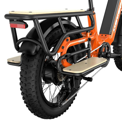 A large Hovsco basket mounted on the back of an orange Hovsco electric bike to increase cargo capabilities.