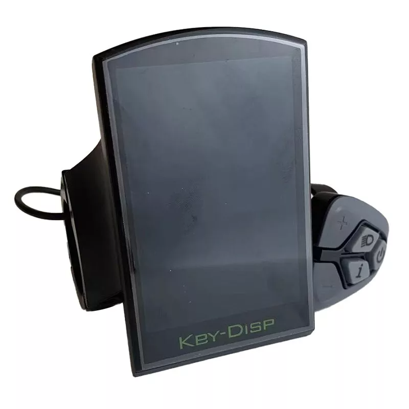 The Key Display KD718, an electronic device labeled "KEY-DISP," features a screen and control buttons connected by a wire—an essential component for managing ebike functions.