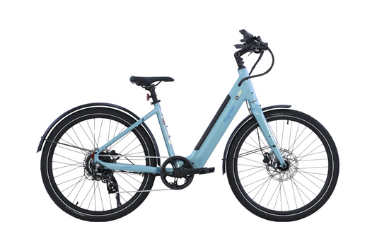 The AIMA - Key West by AIMA is a light blue electric bike with disc brakes, front and rear fenders, and a down tube-integrated battery, shown in side profile on a white background from Tampa Bay eBikes.