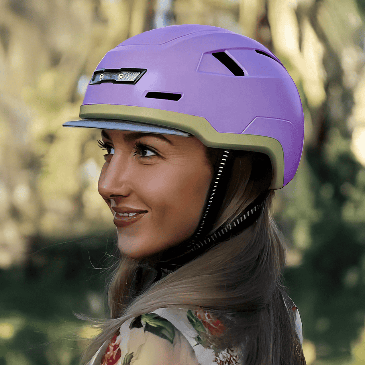 Wearing the XNITO Helmet XNITO - Old School in Lavender, a person looks left outdoors with blurred greenery in the background, ensuring safety.