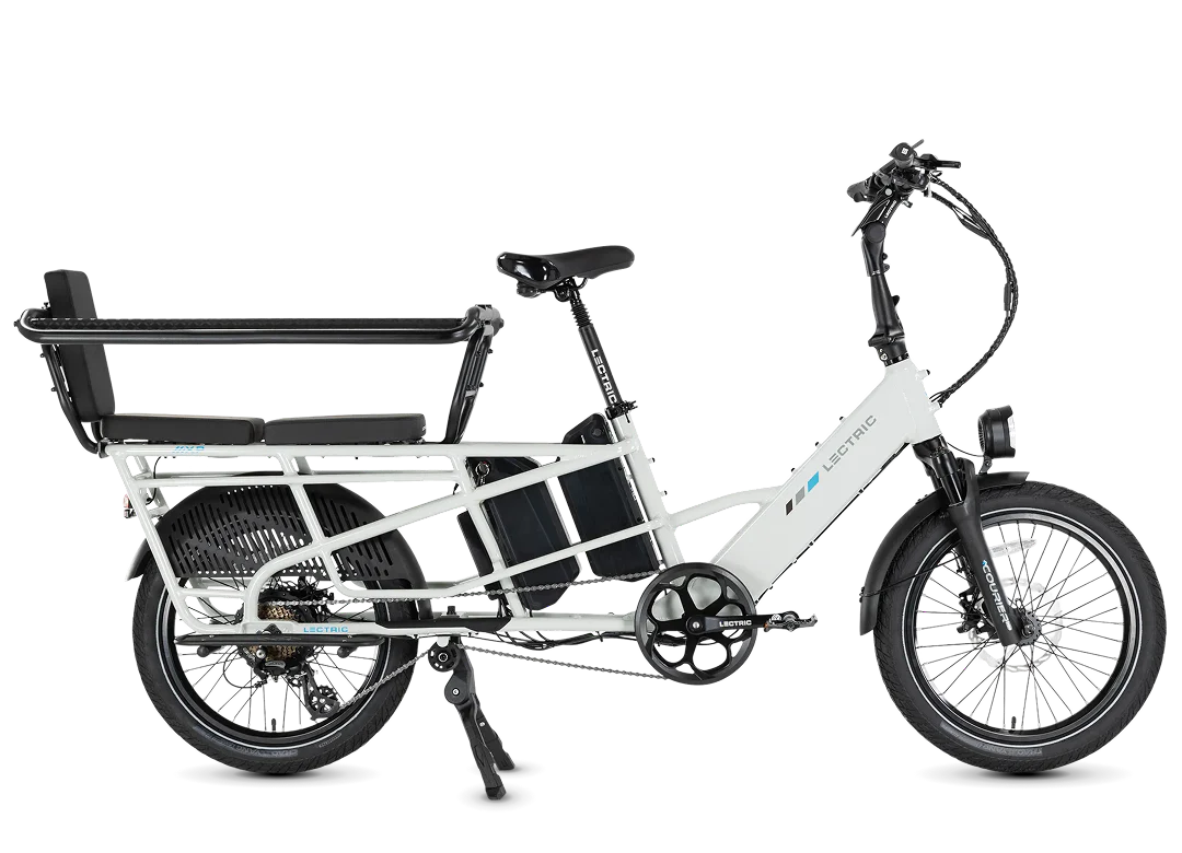The Lectric XPedition2 Cargo Electric Bike by Lectric is shown in a side profile view against a white background, featuring a white frame with a rear passenger seat, footrests, and an integrated battery mounted on the frame. Ideal for riders seeking long-range electric bike reliability, this model is highlighted as part of the Tampa Bay eBikes collection.