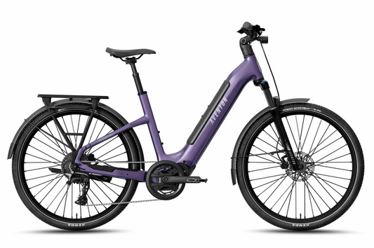 Aventon's Level 4 ADV commuter eBike in purple, featuring a step-through frame, mid-drive system, rear rack, front suspension fork, disc brakes, and Kenda tires, is shown in profile against a white background.