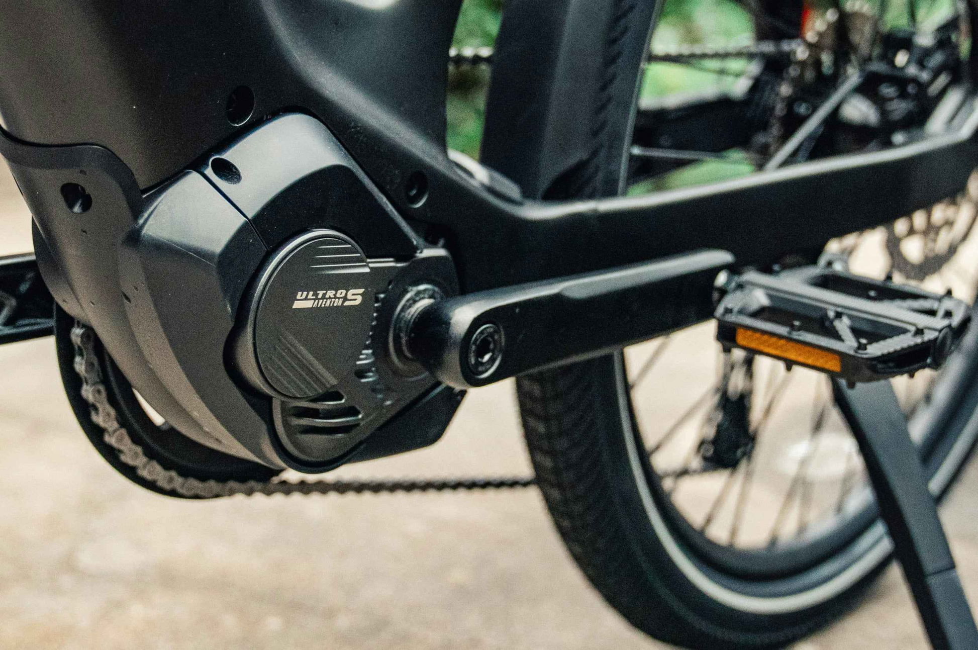 Close-up of the Aventon Level 4 ADV’s motor and pedal crank, showing the "Ultra S Version 1" label on the mid-drive electric bike from Aventon.