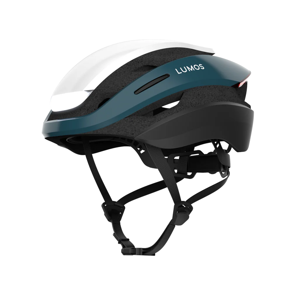 A side view of the Lumos Ultra MIPS helmet by Lumos shows its blue and white shell, black straps, and integrated LED lighting for added cycling safety.