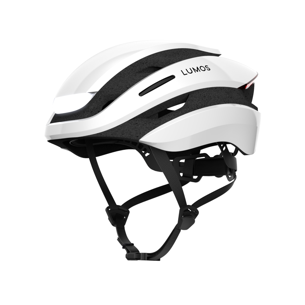 A white Lumos Ultra MIPS Helmet with integrated LED lighting visible on the back, enhancing cycling safety.