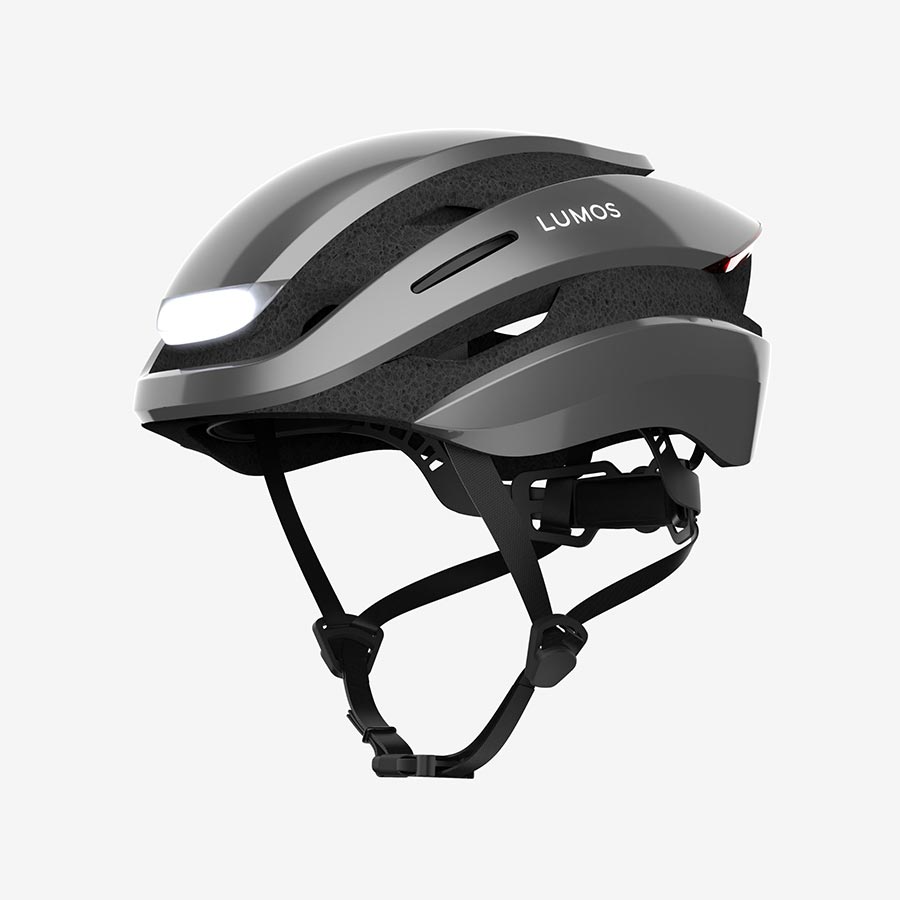 A Lumos Ultra MIPS Helmet designed for cyclist safety, with integrated lights on a white background.
