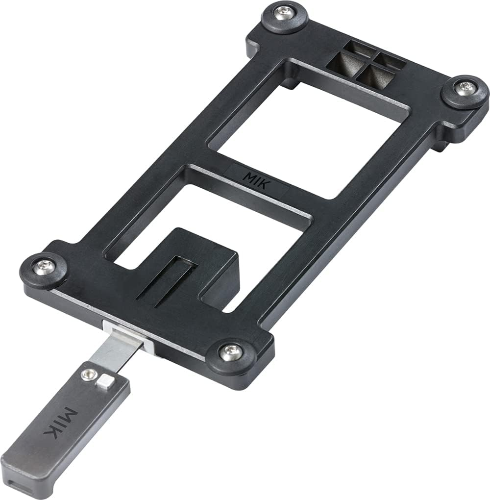 A metal and plastic mounting bracket with multiple screw points and a handle, labeled "Basil MIK Adapter Plate," is ideal for securely attaching bike baskets or luggage racks.