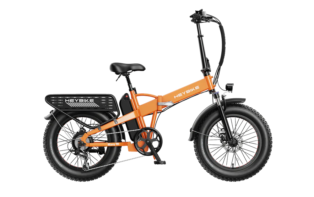 Orange HeyBike Mars 2.0 folding electric bicycle with fat tires and rear rack, displayed against a striped black and white background.