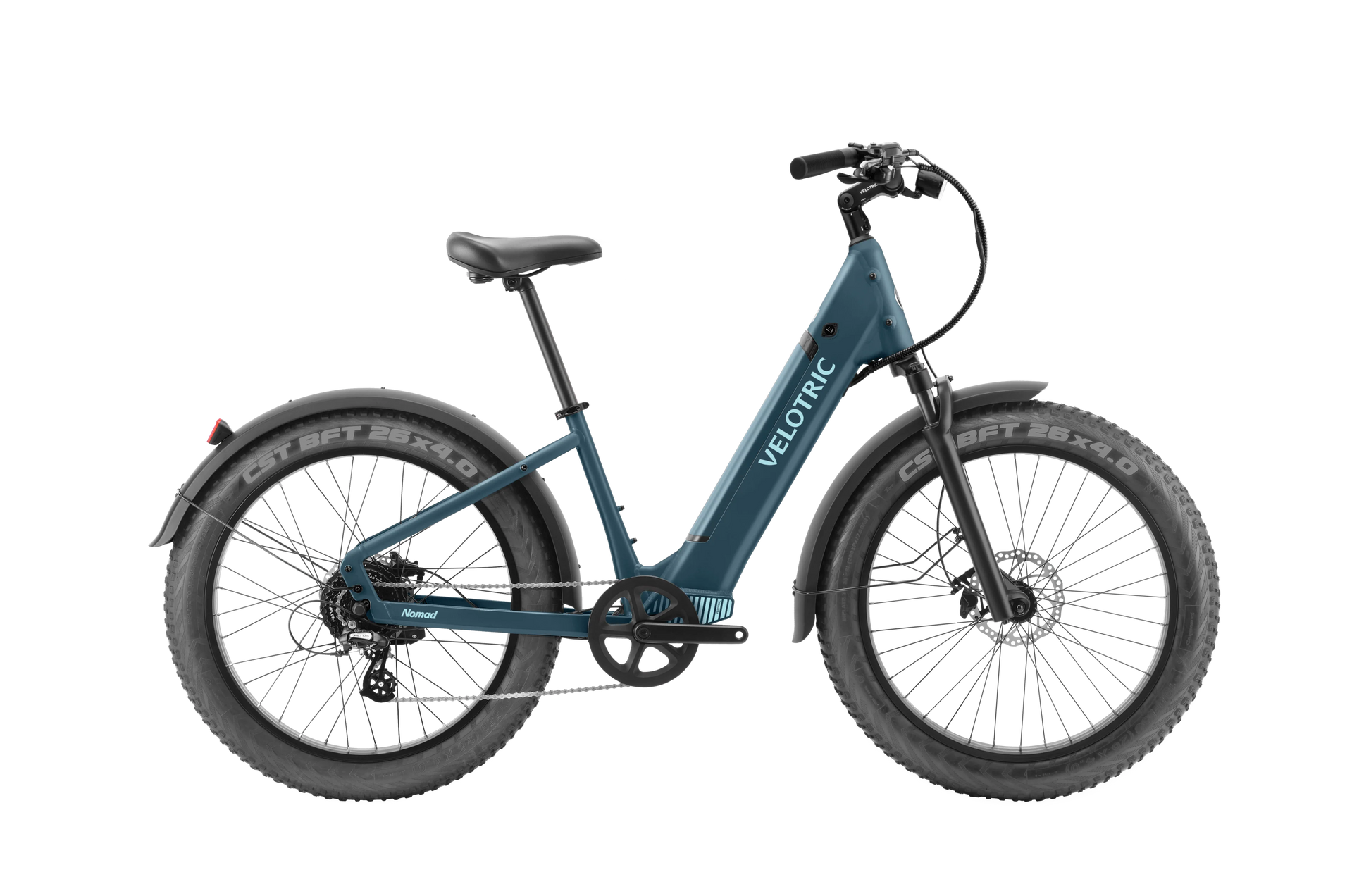 The Velotric Nomad 1 Plus, a blue electric commuter e-bike, features a step-through frame and thick tires with the "Velotric" branding. Equipped with the Velopower H50 drive system, it ensures a smooth and efficient ride.