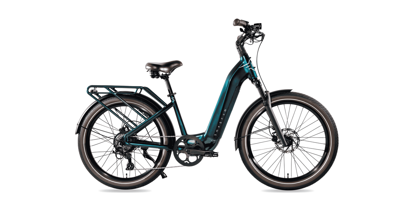 The Magnum Melody by Magnum is a dark teal electric bike with a step-through frame, rear cargo rack, upright handlebars, wide tires, and front and rear fenders, shown in profile on a white background.