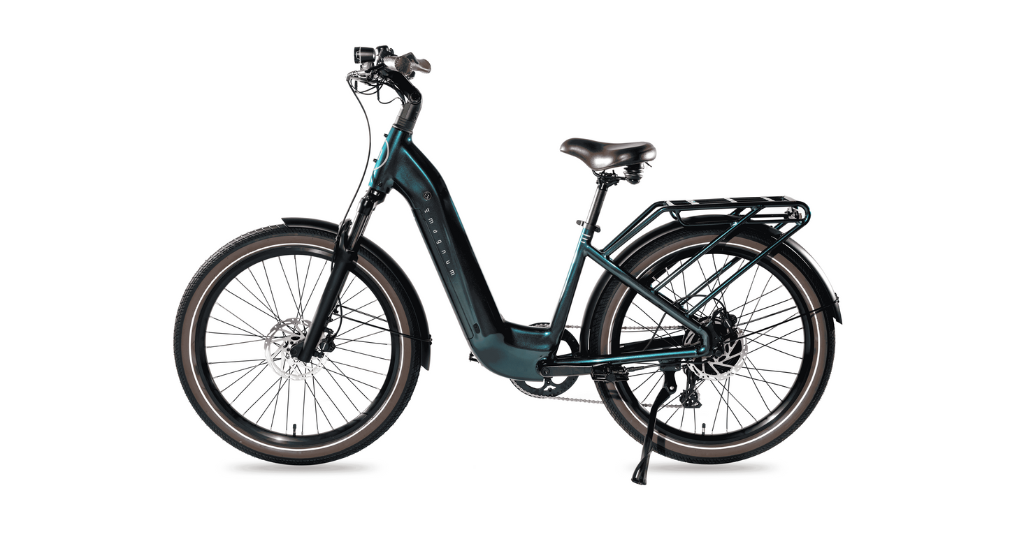A Magnum Melody electric bike by Magnum, featuring a teal low-step commuter frame, wide tires, rear cargo rack, disc brakes, fenders, and kickstand, is shown in profile against a white background.